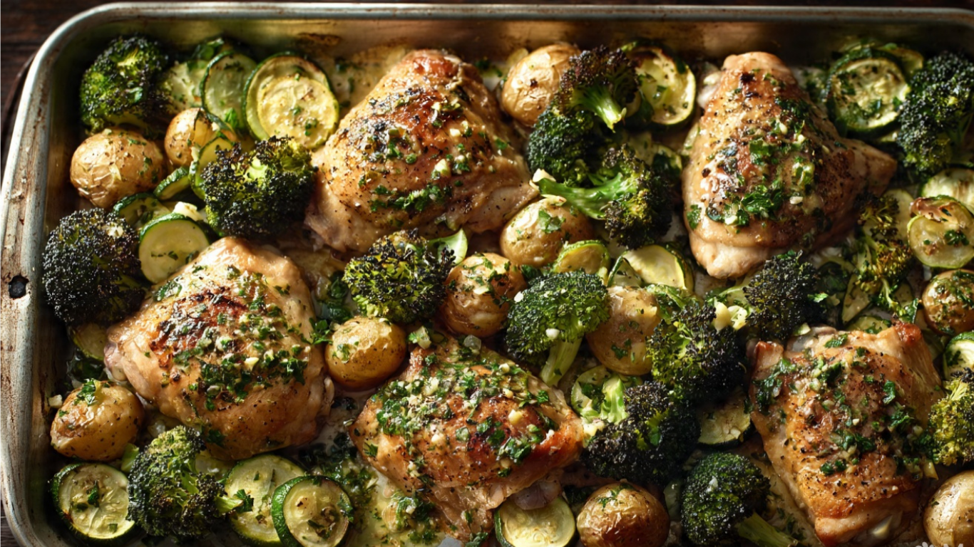 A bright slightly overhead food photograph of sheet pan garlic butter chicken and roasted vegetables, perfectly golden chicken thighs surrounded by caramelized broccoli florets, baby potatoes, and sliced zucchini, glistening with garlic herb butter, fresh from the oven on a large rimmed baking sheet, warm natural light from above, vibrant greens and golden browns, fresh and wholesome mood, photorealistic food styling, no text, no logos, no watermarks, clean and unbranded